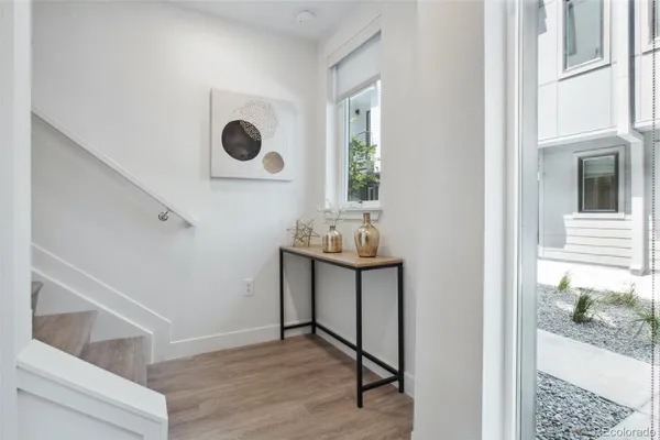 a view of workspace with window and hallway