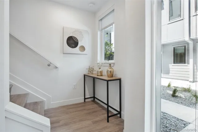 a view of workspace with window and hallway