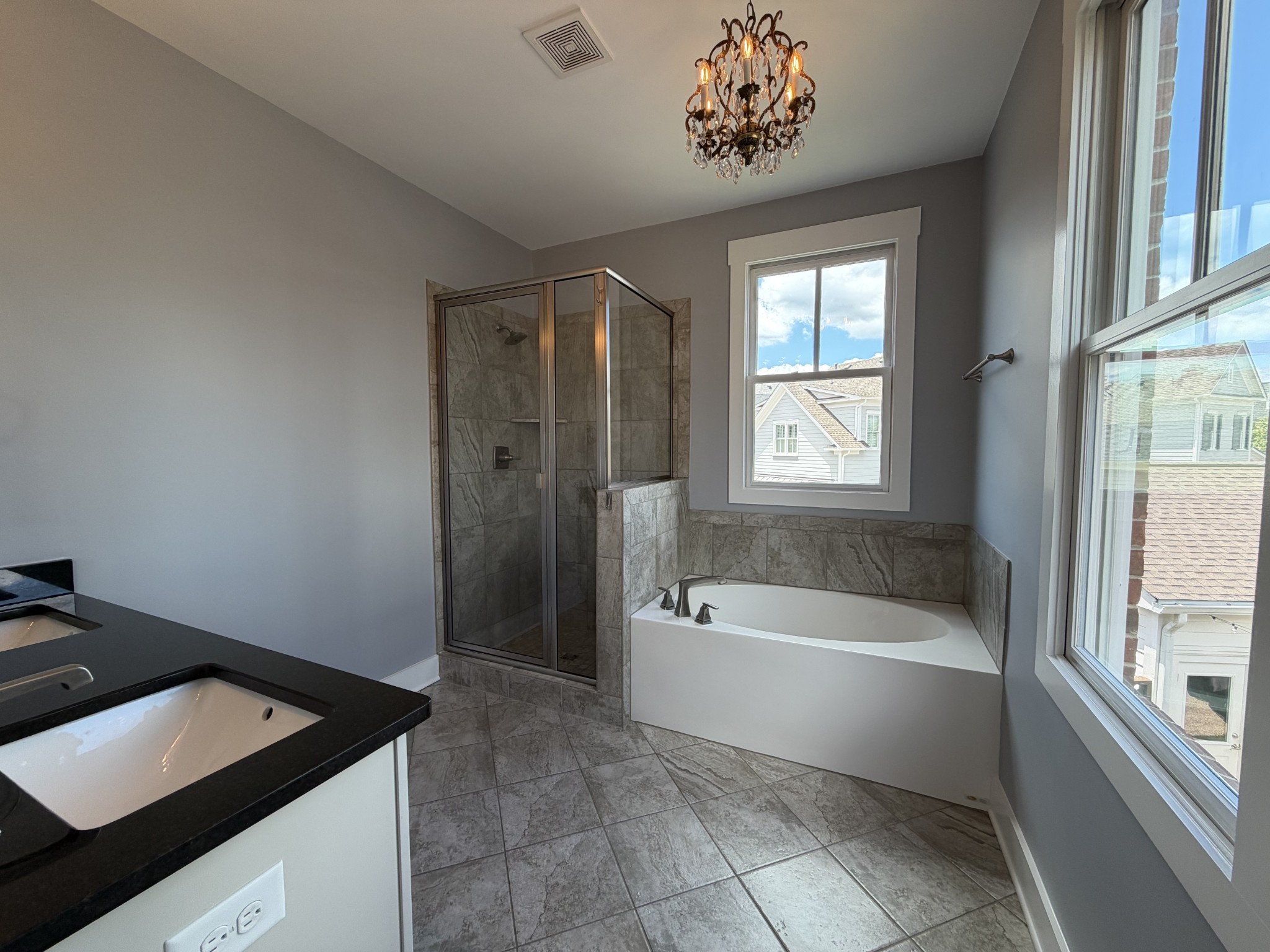 3097 Rural Plains Circle Franklin, TN 37064 - Photo 15 of 28 a bathroom with a tub sink and window
