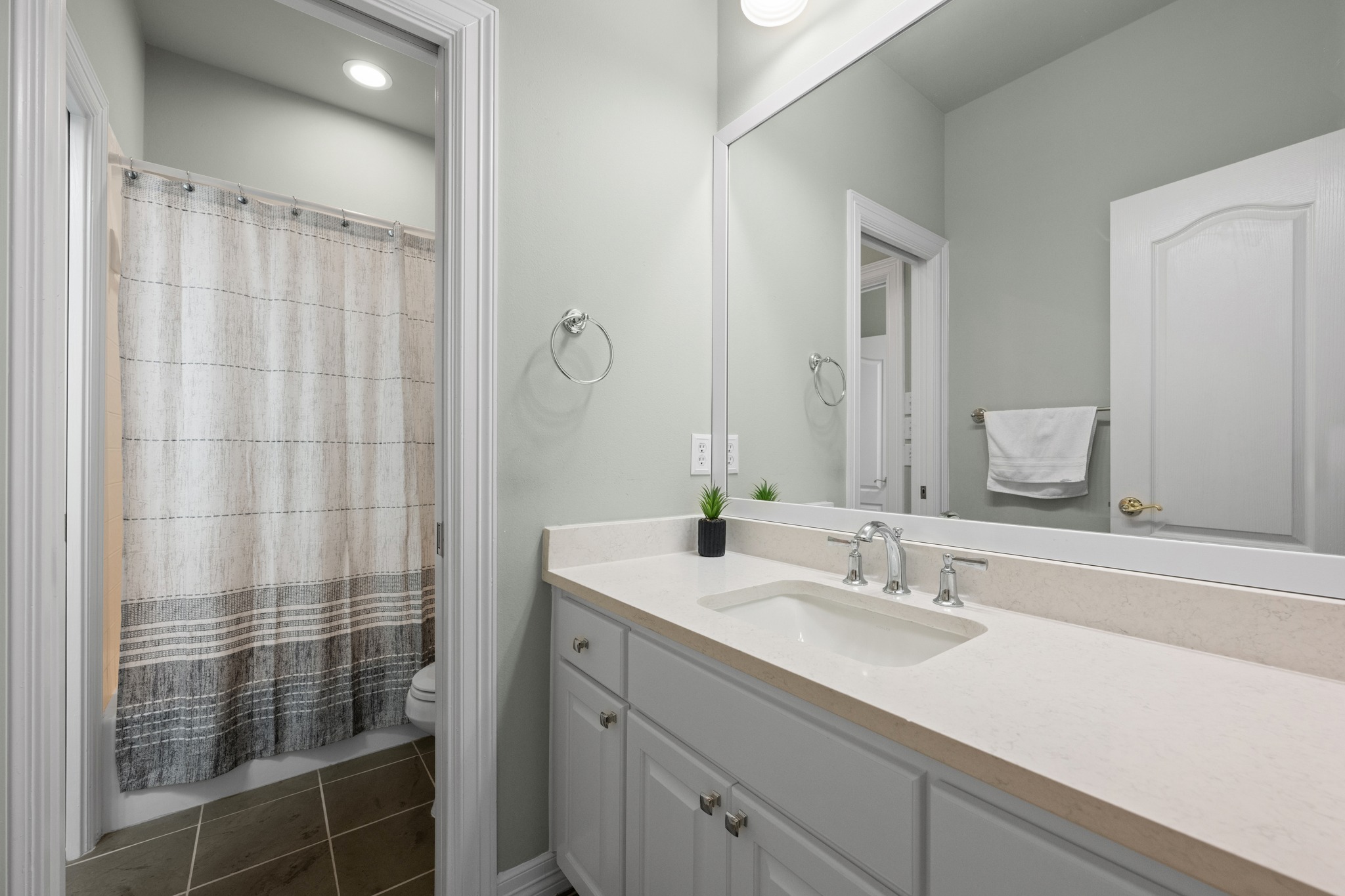 6004 Mt Bonnell Road Austin, TX 78731 - Photo 22 of 24 a bathroom with a sink double vanity and shower