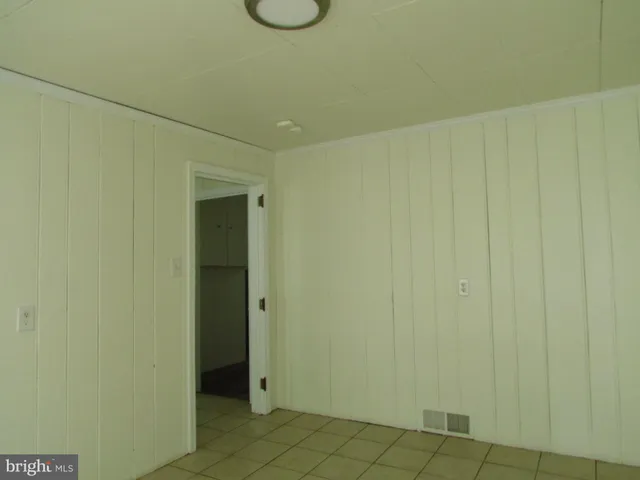 a bathroom with a shower and a sink