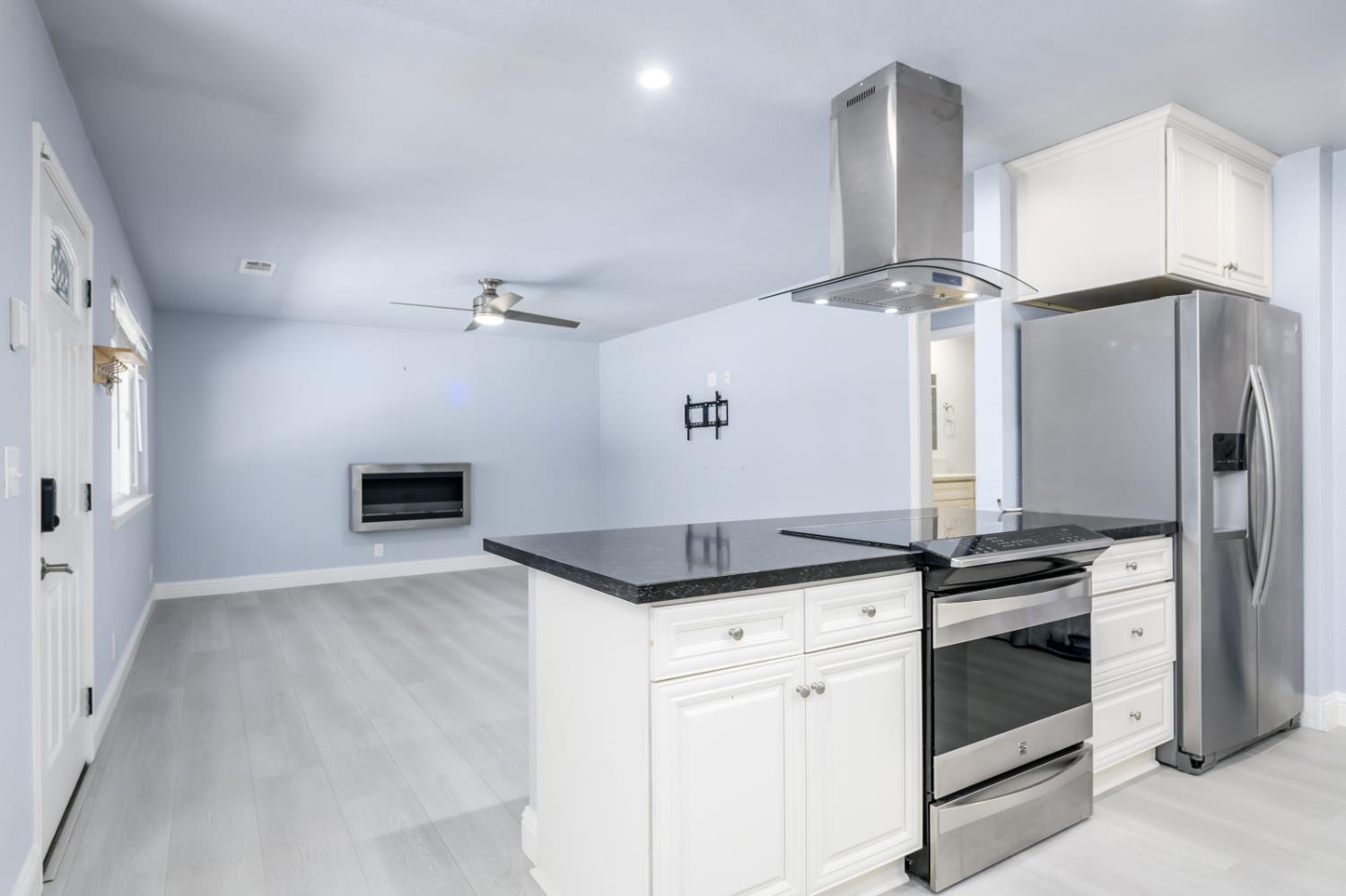 2873 Anderson Way Placerville, CA 95667 - Photo 8 of 24 a kitchen with granite countertop a stove and a refrigerator