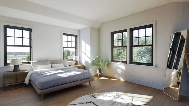 a bedroom with furniture and a large window