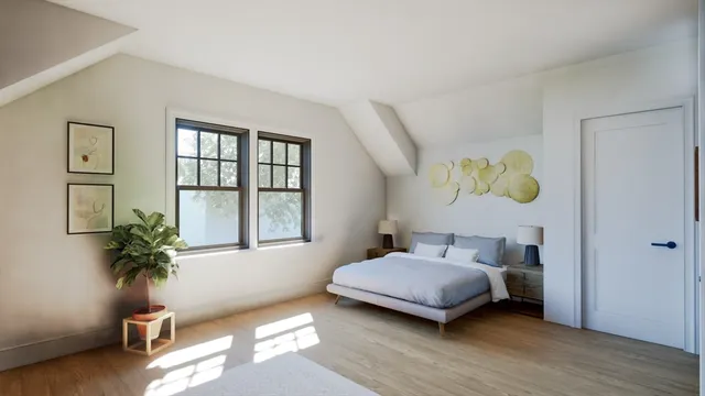 a bedroom with furniture and a flat screen tv