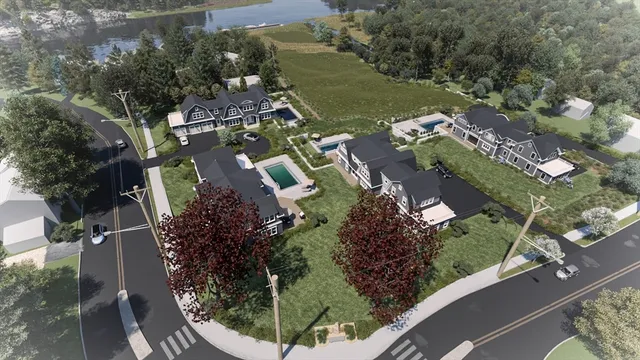 an aerial view of residential houses with outdoor space
