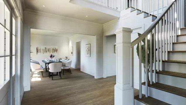 a view of a hallway with wooden floor and stairs