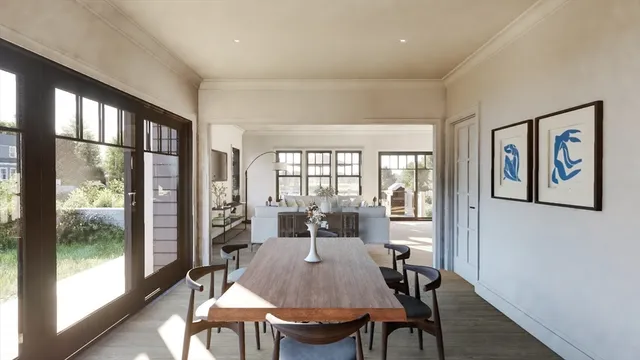 a view of a dining room with furniture large window and wooden floor