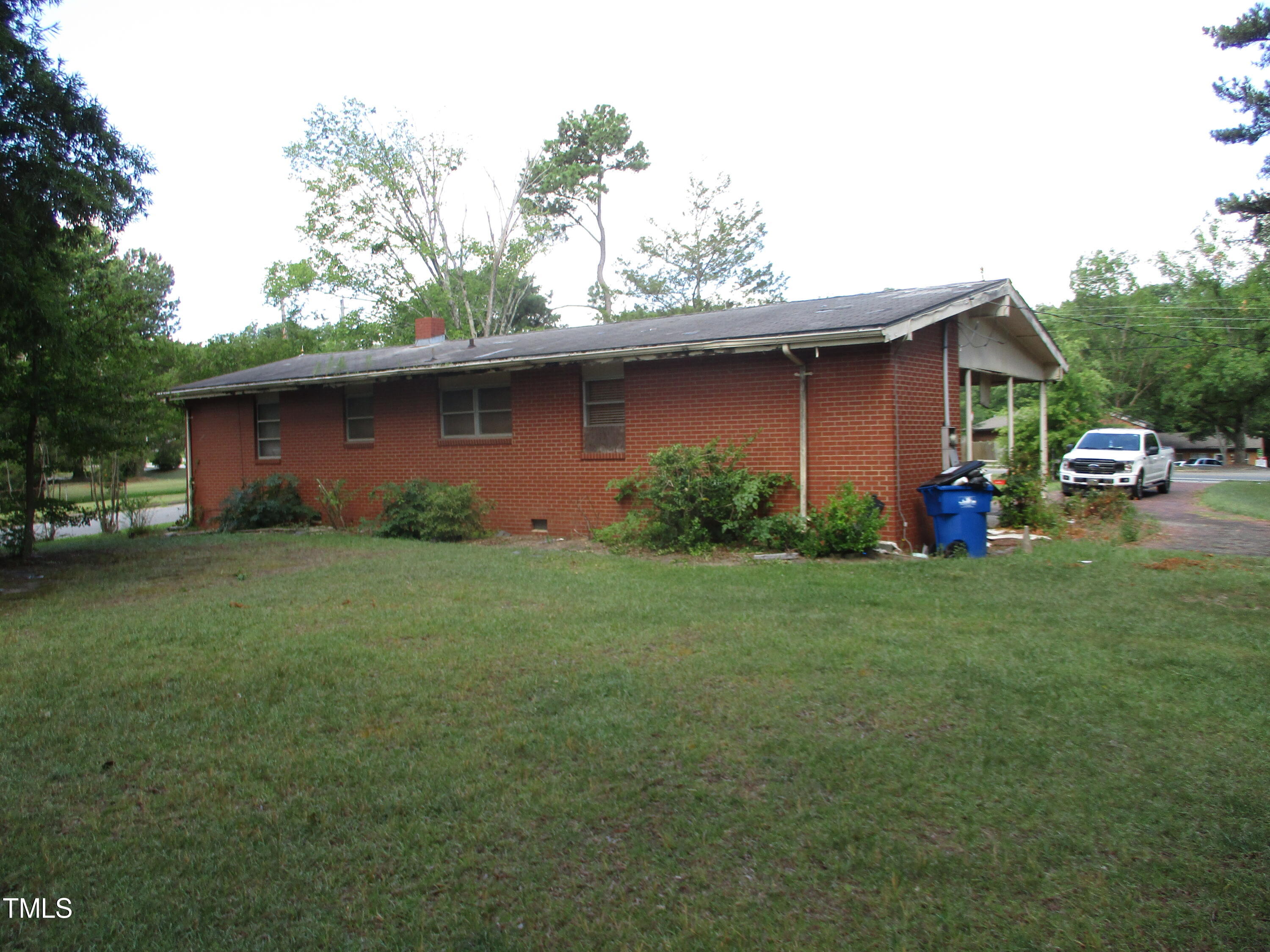 1432 Cross Link Road Raleigh, NC 27610 - Photo 6 of 16 a front view of a house with garden