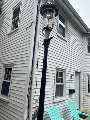 66 R Foster Street, Unit 66 Boston, MA 02135 - Photo 5 of 9 a view of a house with a white door