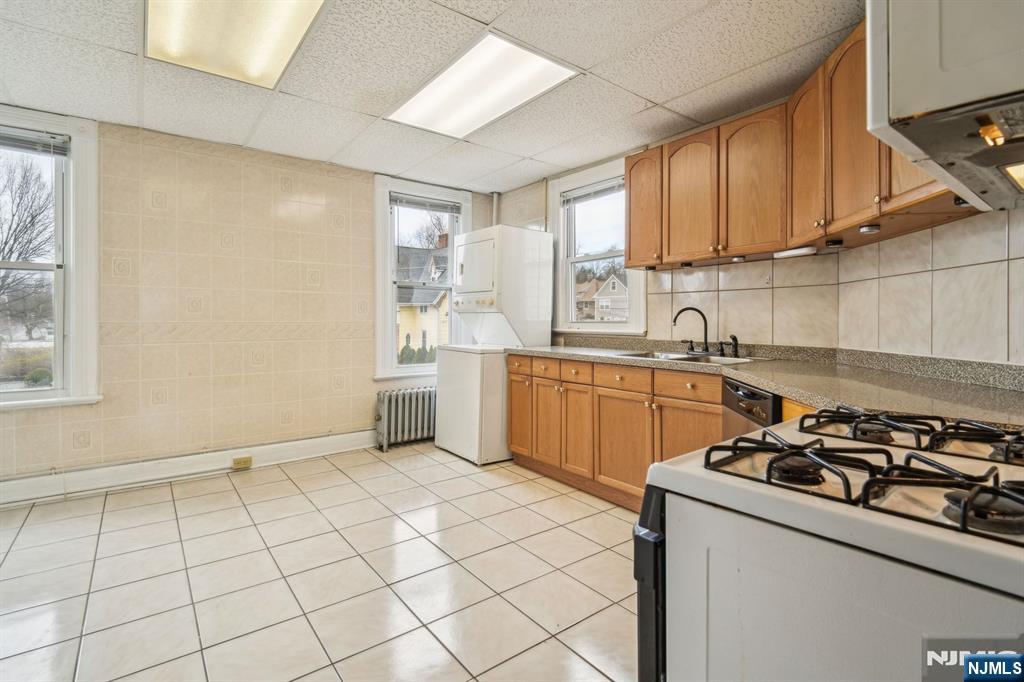 44 Elm Street, Unit 2 Montclair, NJ 07042 - Photo 14 of 33 a kitchen with a sink a stove cabinets and a window