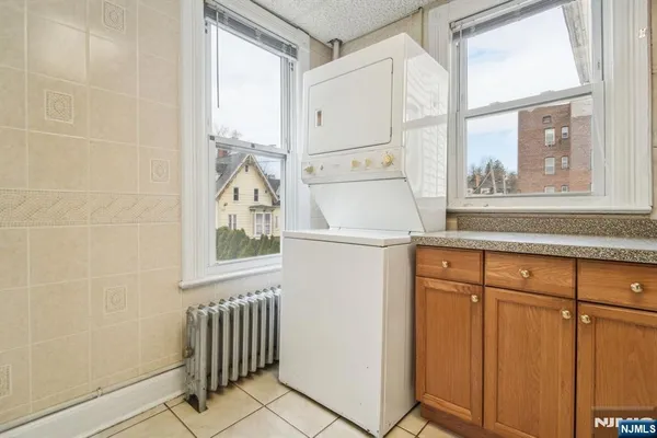 a white refrigerator freezer sitting inside of a kitchen