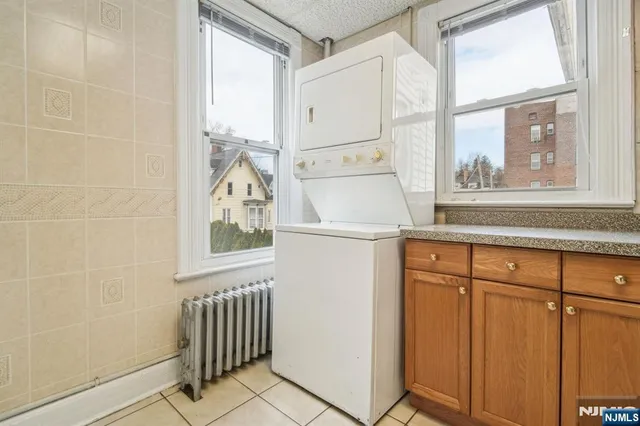 a white refrigerator freezer sitting inside of a kitchen