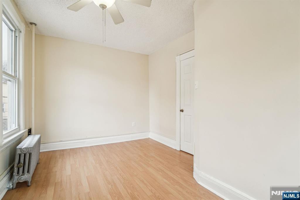 44 Elm Street, Unit 2 Montclair, NJ 07042 - Photo 19 of 33 a view of an empty room with wooden floor and a window