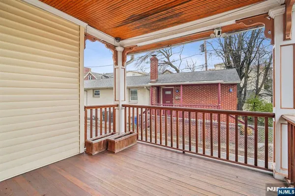 a view of a chair and table in the balcony