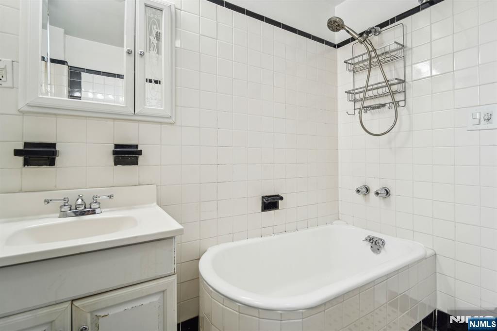 44 Elm Street, Unit 2 Montclair, NJ 07042 - Photo 22 of 33 a bathroom with a bath tub a sink and a shower