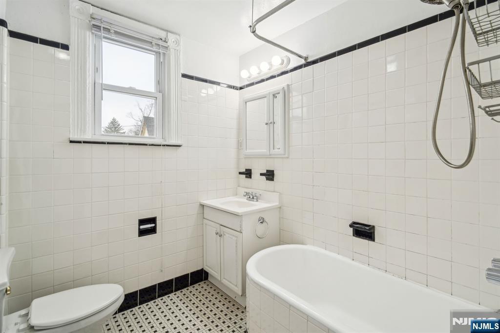 44 Elm Street, Unit 2 Montclair, NJ 07042 - Photo 23 of 33 a bathroom with a sink a toilet and shower