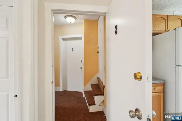 a view of hallway with a washer and dryer