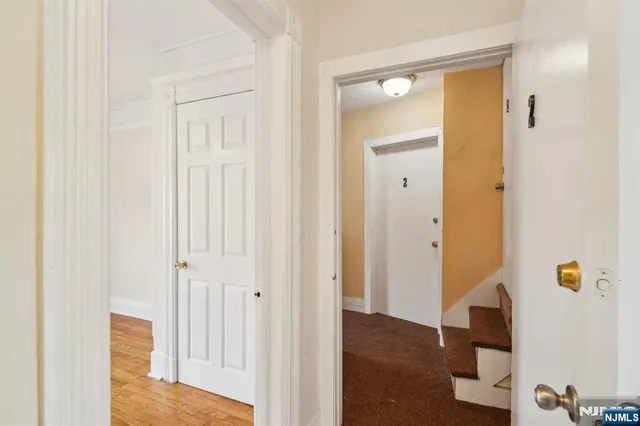 a view of a bathroom from the hallway