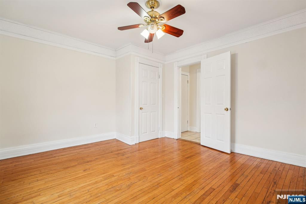 44 Elm Street, Unit 2 Montclair, NJ 07042 - Photo 7 of 33 a view of a room with wooden floor and a ceiling fan