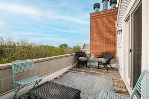 a view of a terrace with chairs