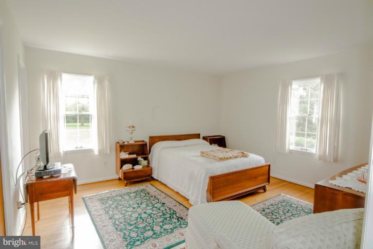4013 Chatham Road Ellicott City, MD 21042 - Photo 1 of 20 a bed room with a bed and a couch