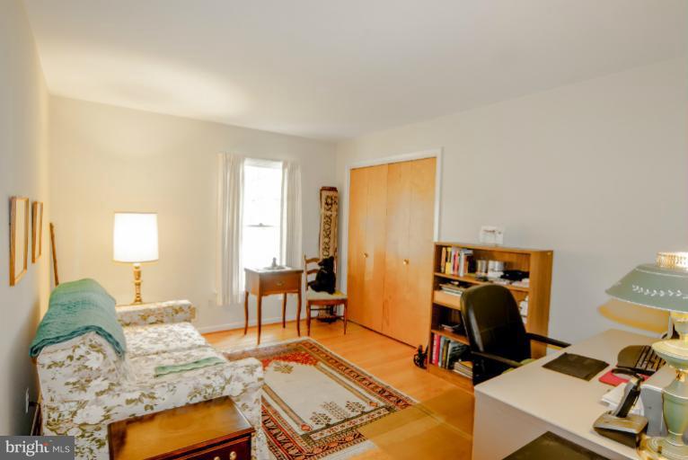 4013 Chatham Road Ellicott City, MD 21042 - Photo 11 of 20 a bedroom with furniture and a gym equipment