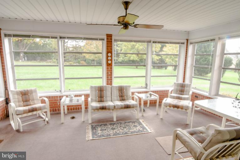 4013 Chatham Road Ellicott City, MD 21042 - Photo 13 of 20 a living room with furniture and large windows