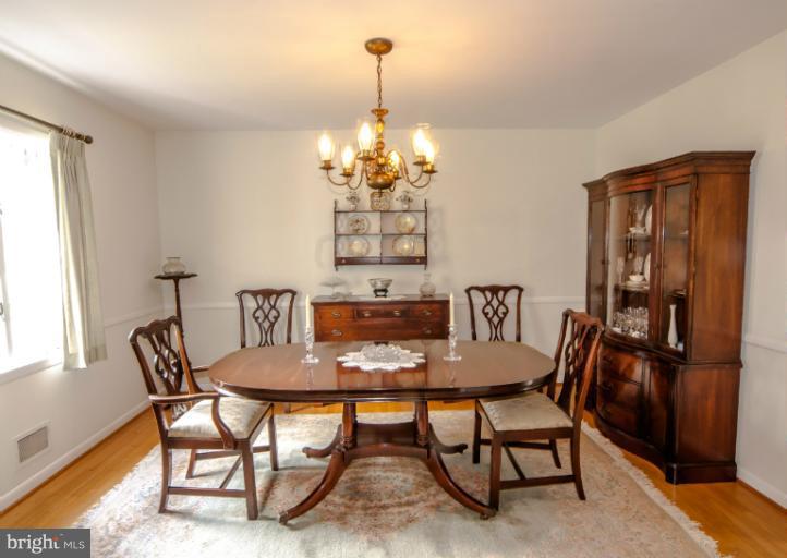 4013 Chatham Road Ellicott City, MD 21042 - Photo 15 of 20 a view of a dining room with furniture and window