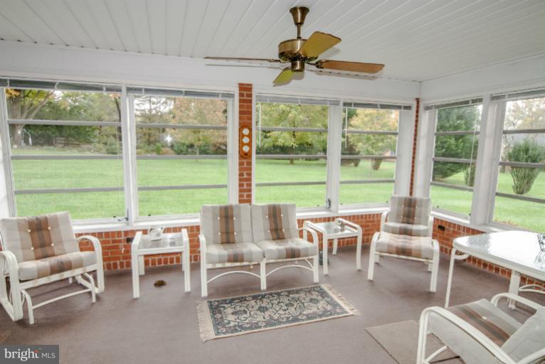 4013 Chatham Road Ellicott City, MD 21042 - Photo 18 of 20 a living room with furniture and a large window