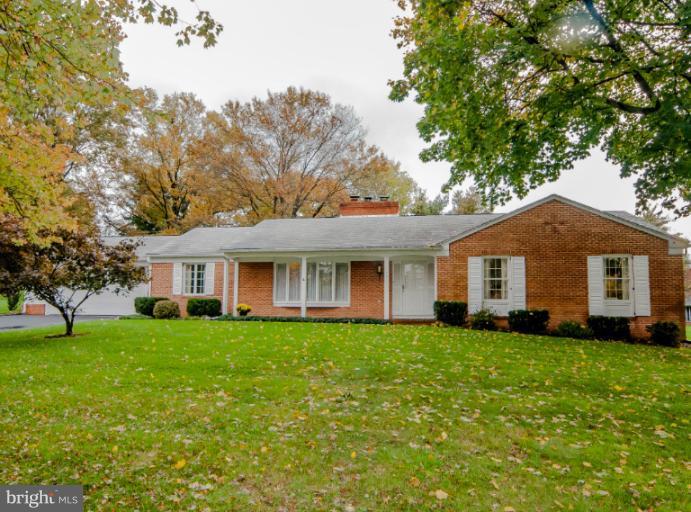 4013 Chatham Road Ellicott City, MD 21042 - Photo 20 of 20 a front view of a house with a garden