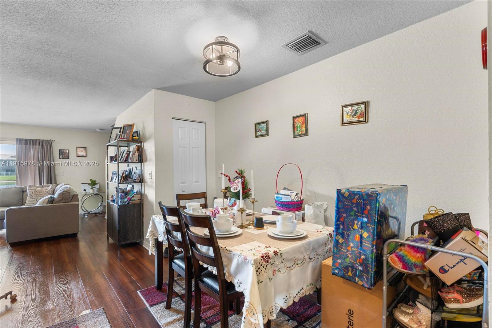 8988 Chambers Street, Unit 8988 Tamarac, FL 33321 - Photo 5 of 8 a view of a dining room with furniture and wooden floor