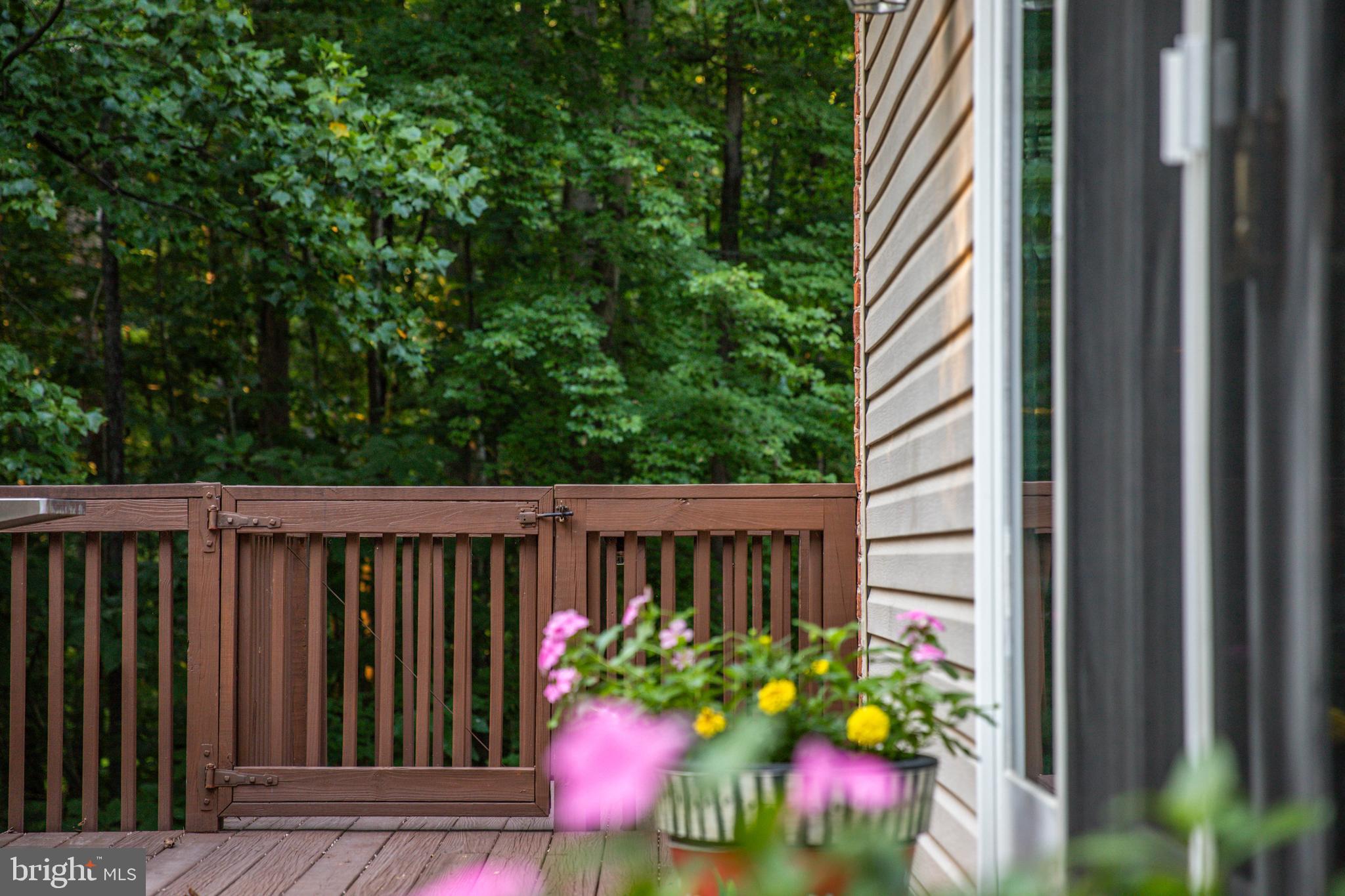 14418 Katie Road Phoenix, MD 21131 - Photo 24 of 29 a view of a house with a flower garden