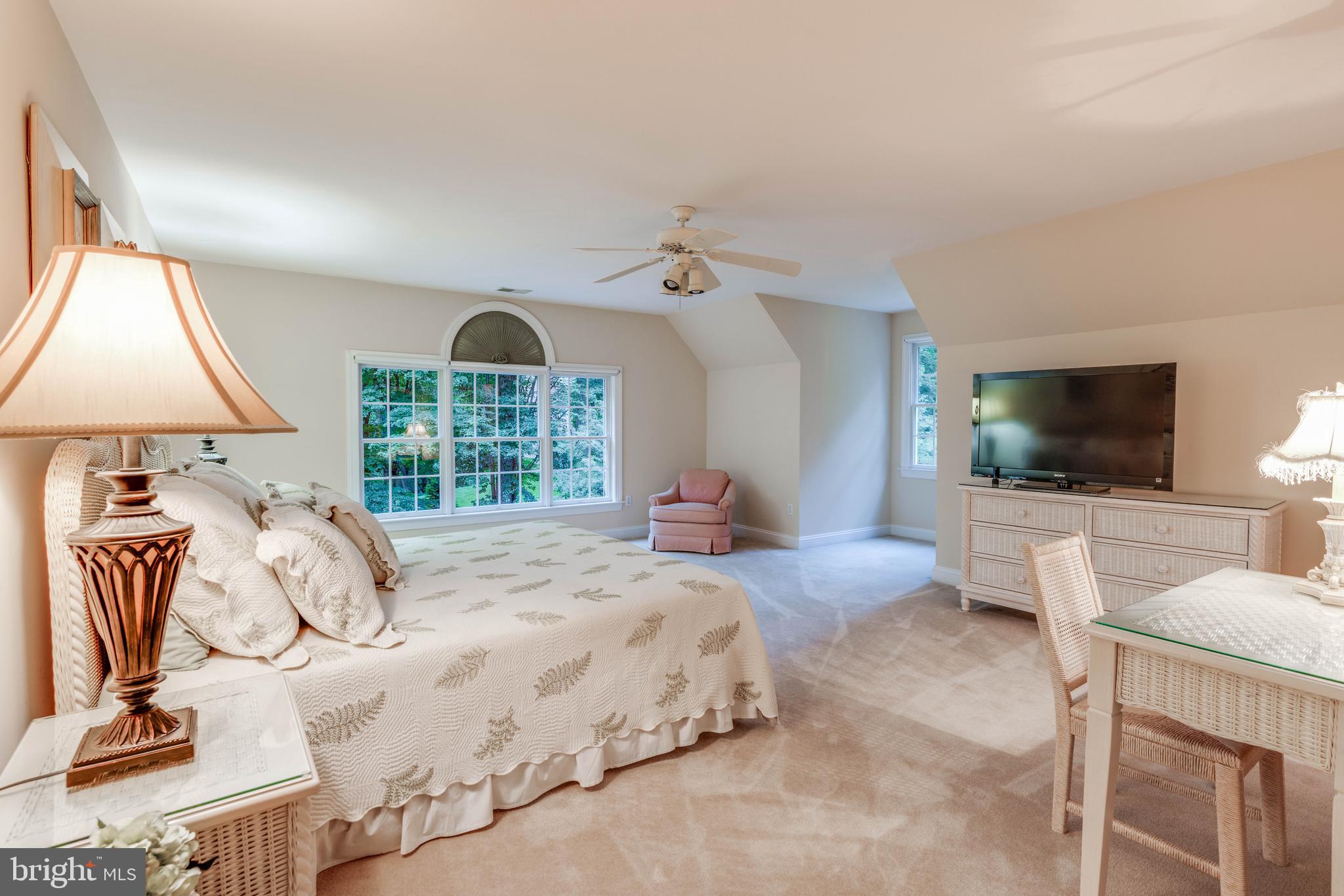 14418 Katie Road Phoenix, MD 21131 - Photo 26 of 29 a bedroom with a bed and a flat screen tv