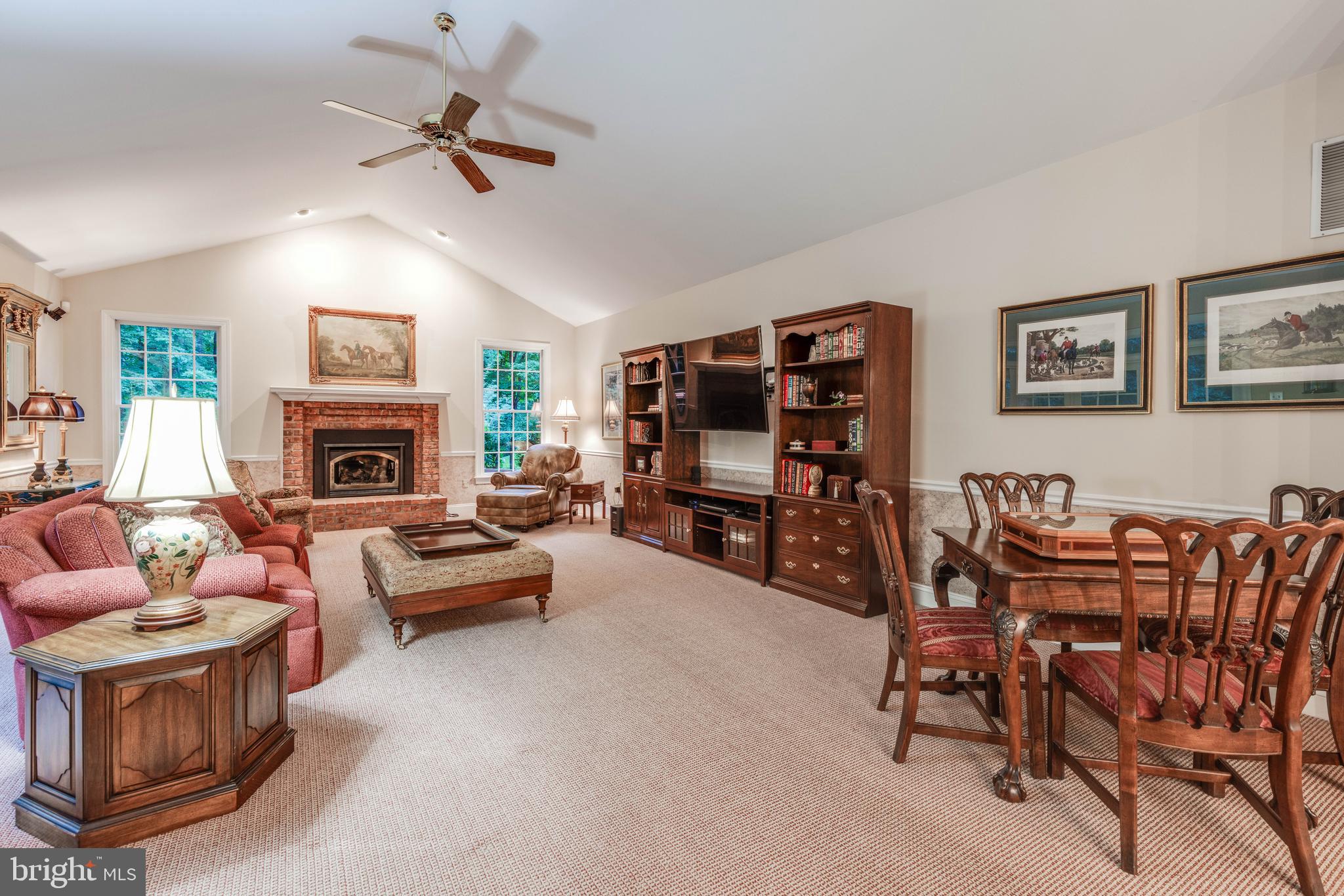 14418 Katie Road Phoenix, MD 21131 - Photo 8 of 29 a living room with furniture a fireplace and a flat screen tv