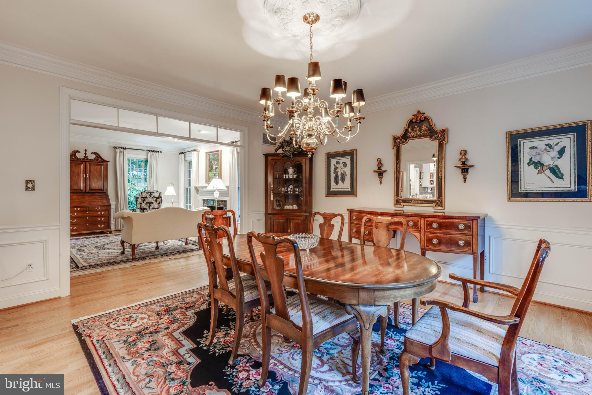 14418 Katie Road Phoenix, MD 21131 - Photo 9 of 29 a view of a dining room with furniture and chandelier