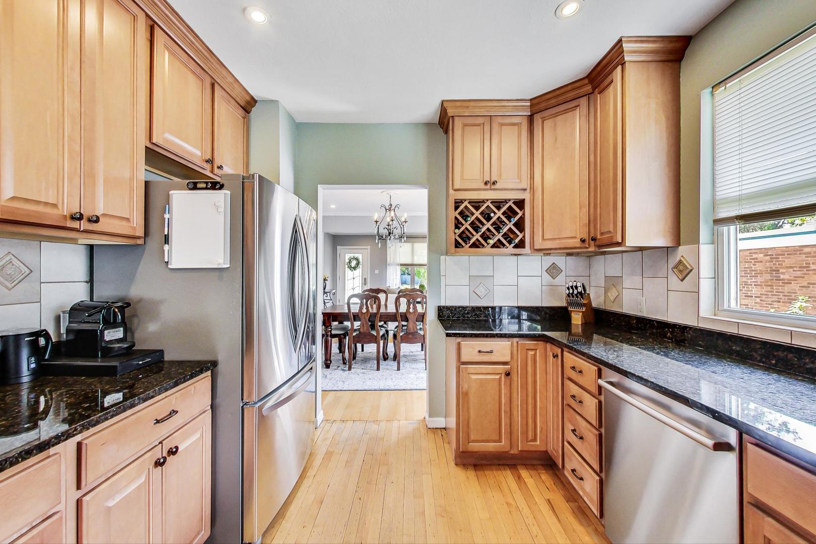 518 South Arlington Heights Road Arlington Heights, IL 60005 - Photo 12 of 42 a kitchen with stainless steel appliances granite countertop a stove a sink and a refrigerator