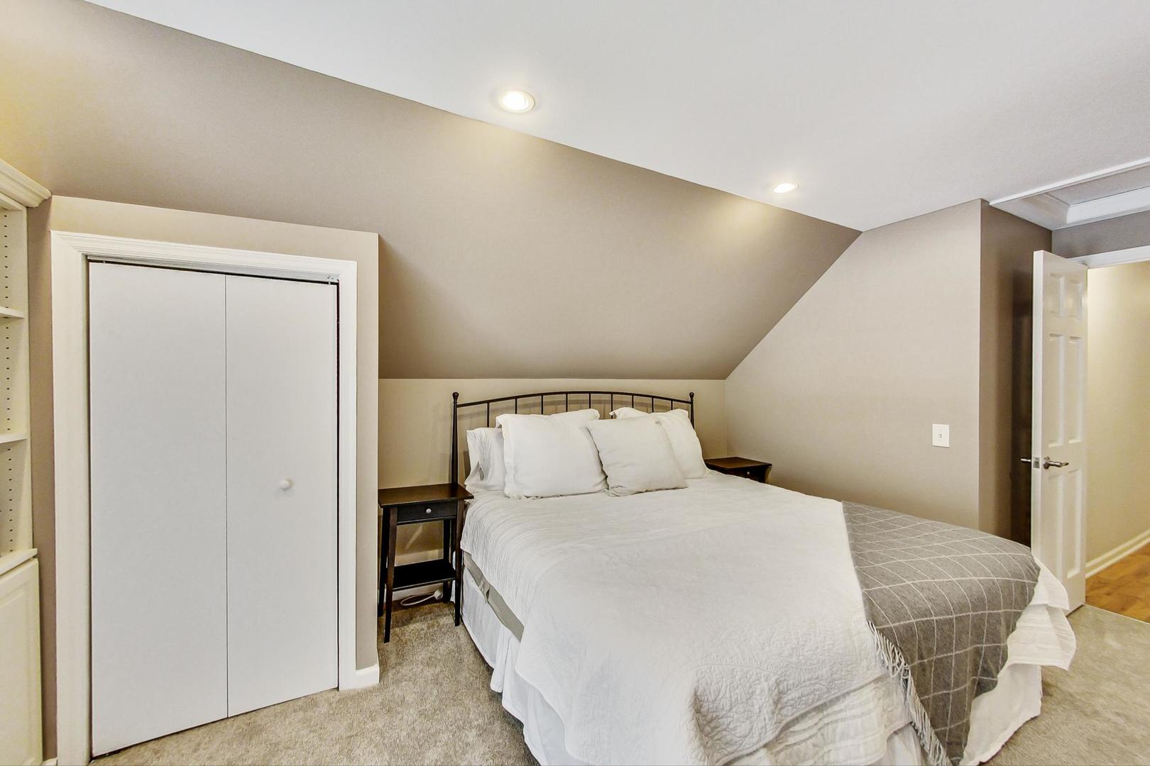 518 South Arlington Heights Road Arlington Heights, IL 60005 - Photo 20 of 42 a large white bed in a white room