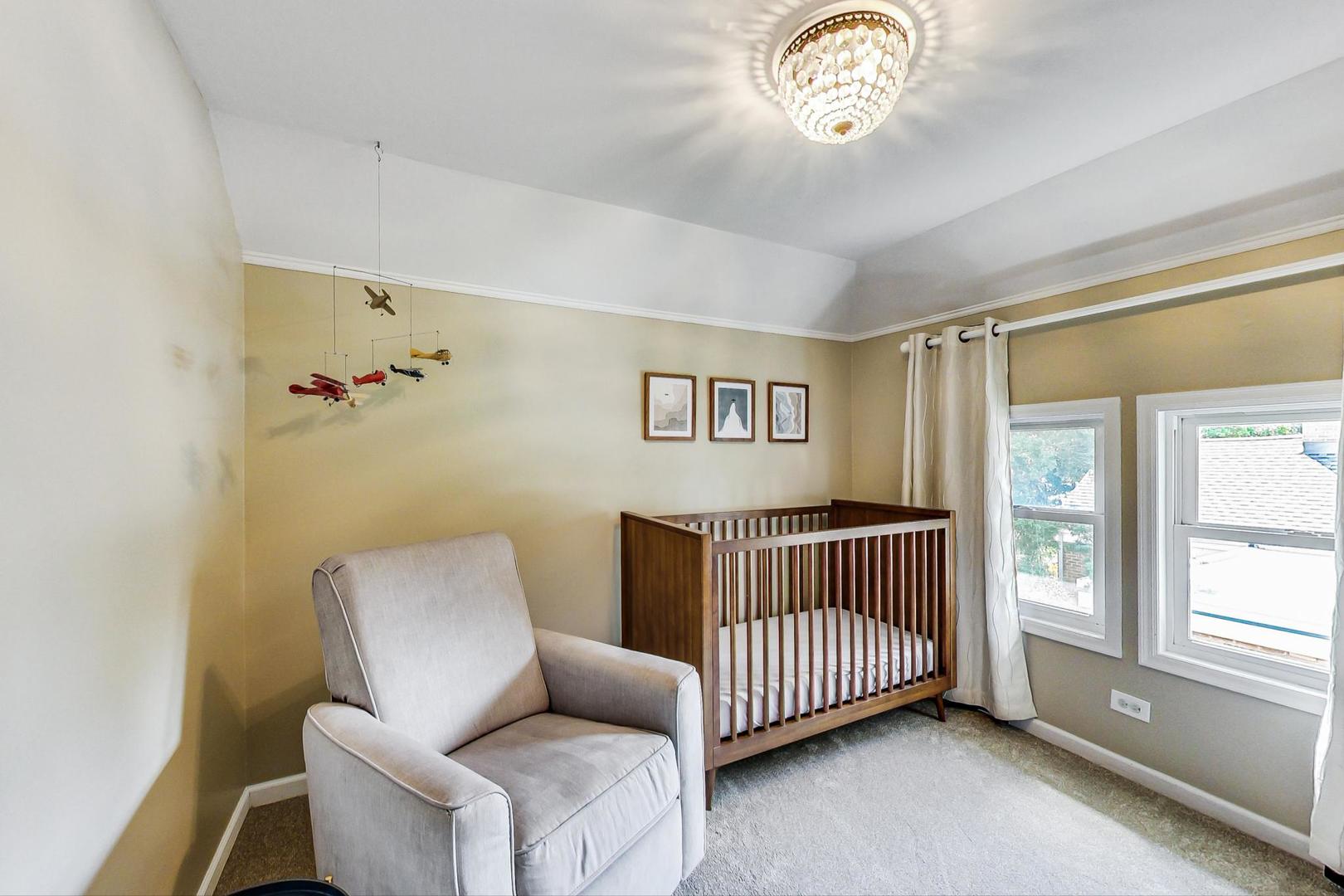 518 South Arlington Heights Road Arlington Heights, IL 60005 - Photo 23 of 42 a bedroom with a bed and a window