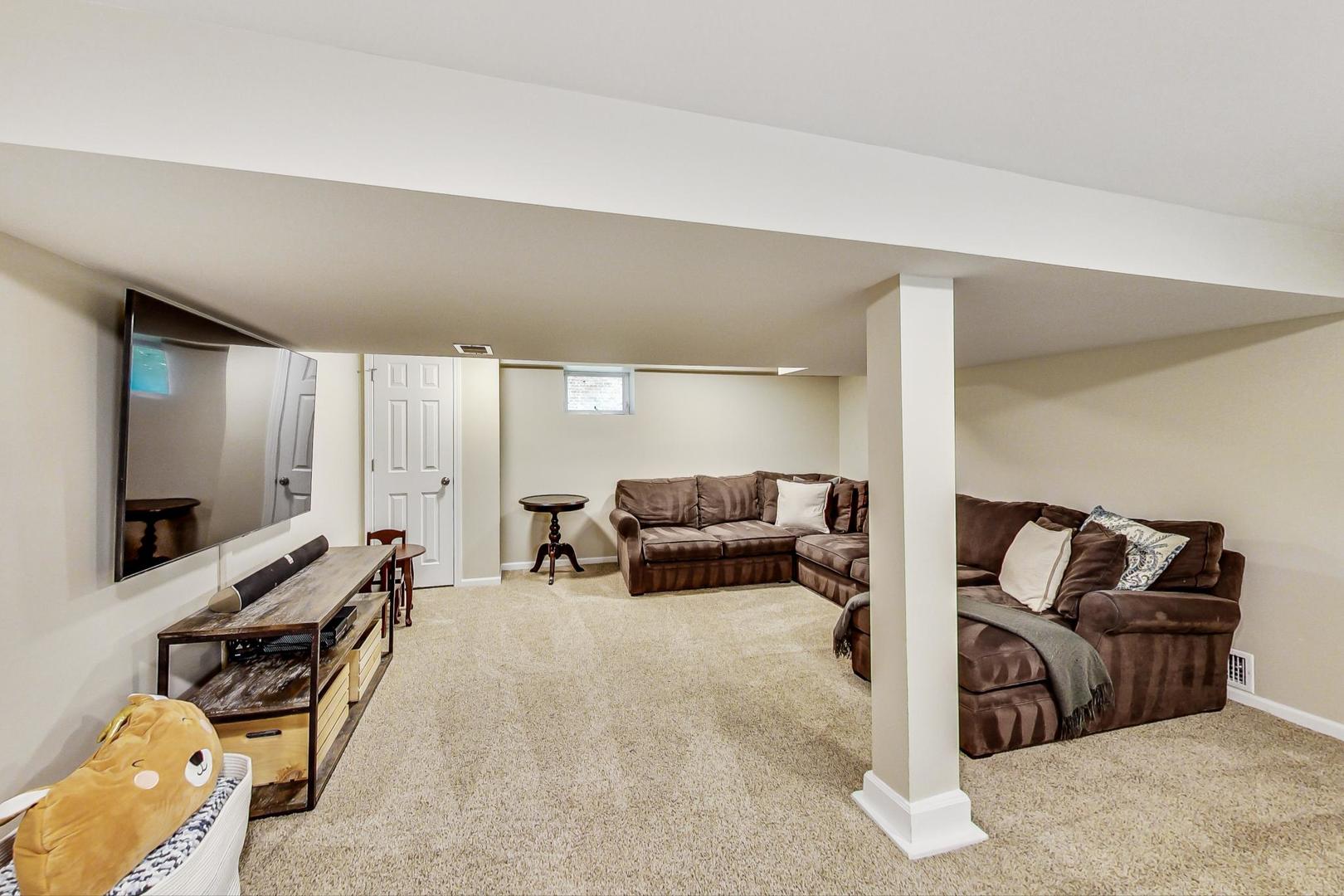 518 South Arlington Heights Road Arlington Heights, IL 60005 - Photo 29 of 42 a living room with furniture and a flat screen tv