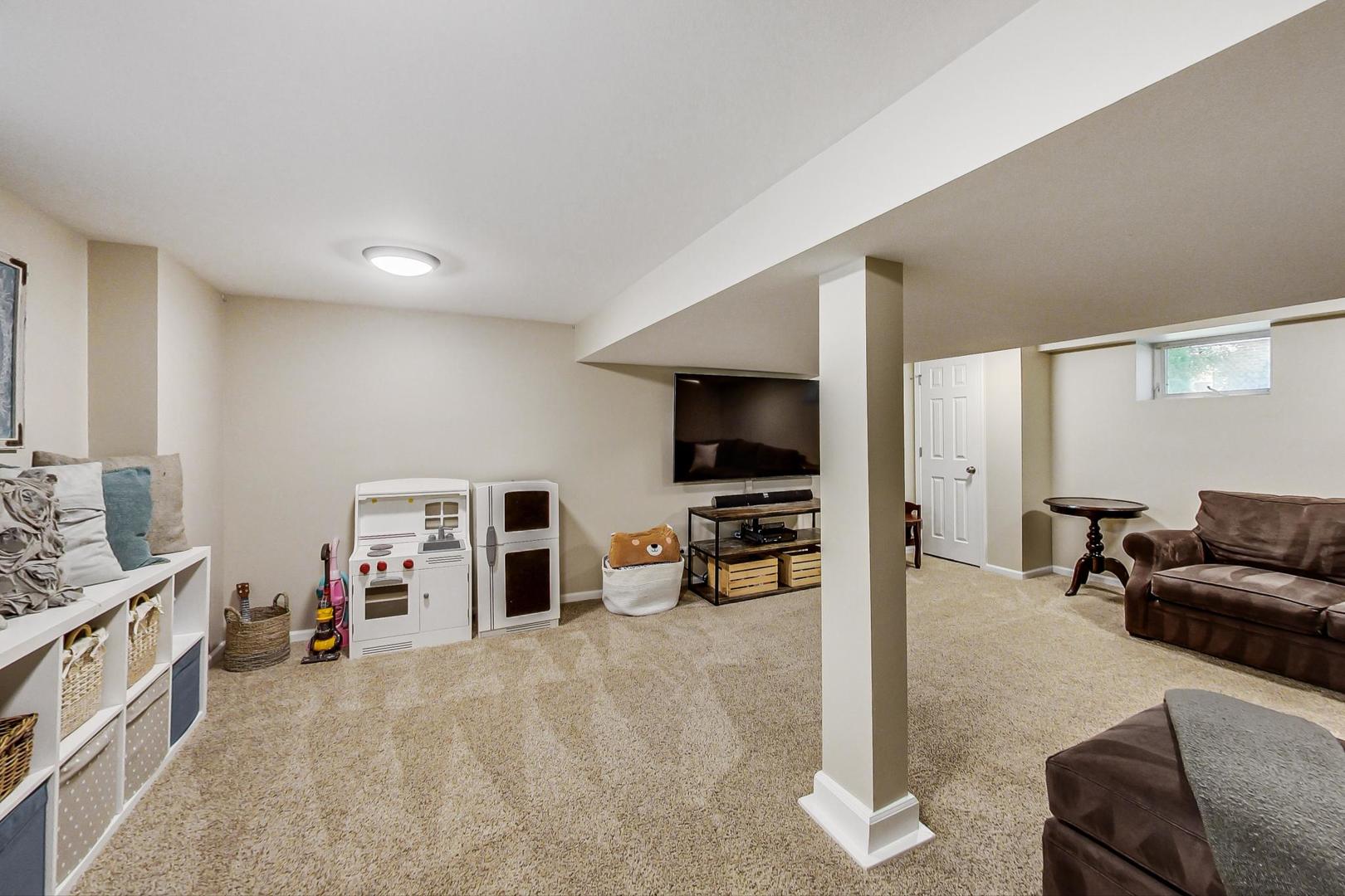 518 South Arlington Heights Road Arlington Heights, IL 60005 - Photo 30 of 42 a living room with furniture and a flat screen tv