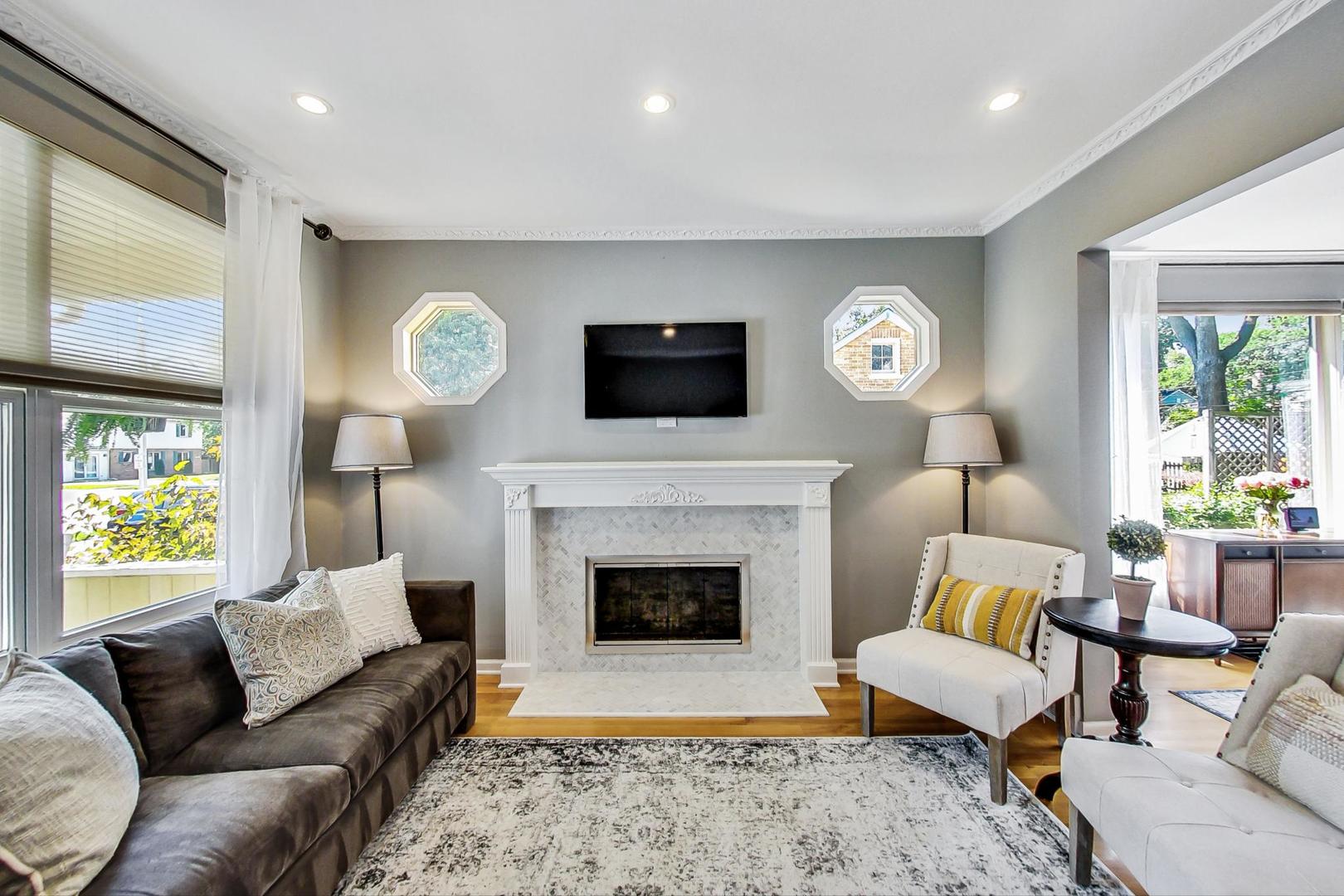518 South Arlington Heights Road Arlington Heights, IL 60005 - Photo 6 of 42 a living room with furniture a fireplace and a flat screen tv