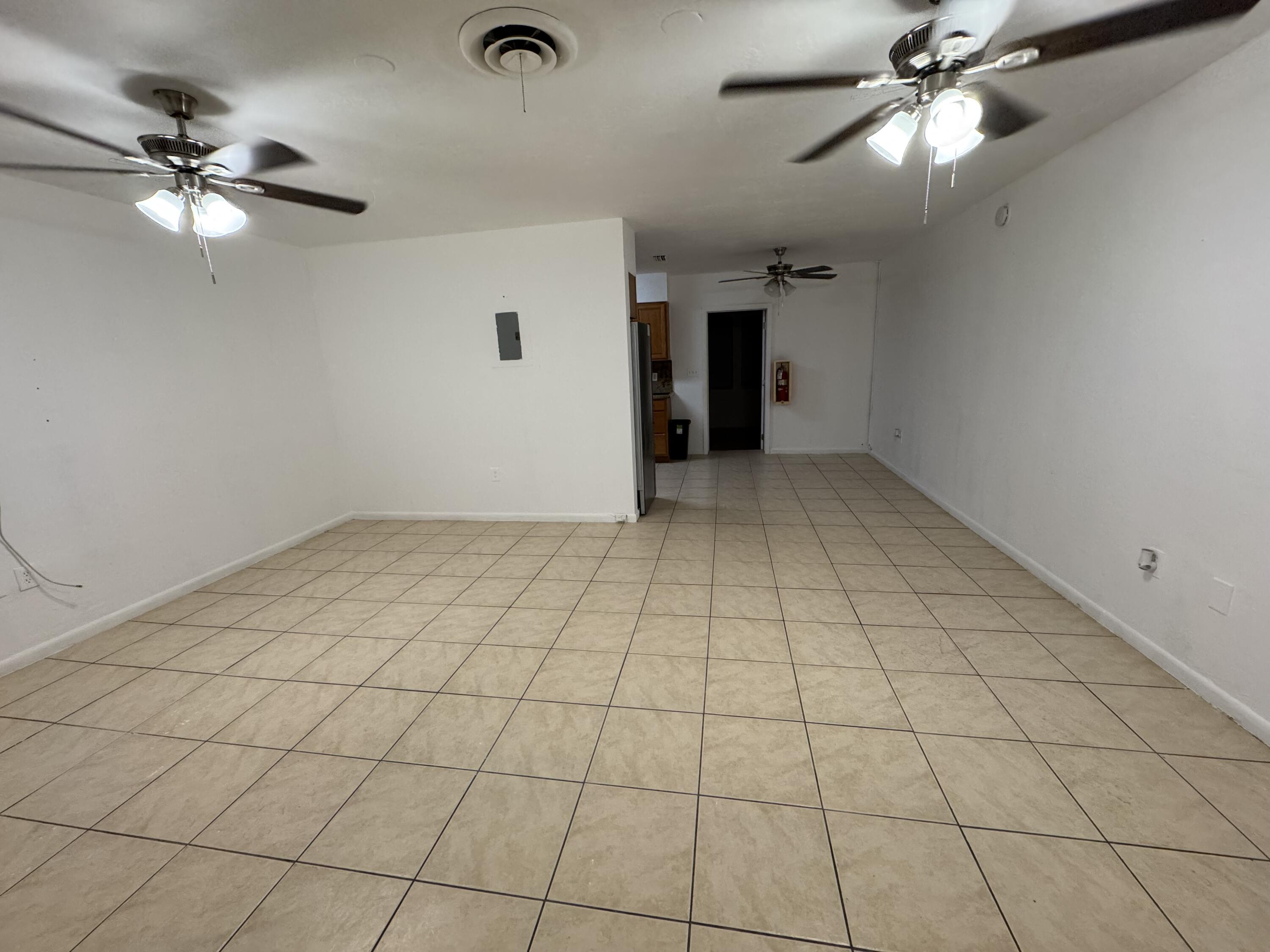198 Southwest 15th Street Boca Raton, FL 33432 - Photo 2 of 11 a view of an empty room and chandelier fan