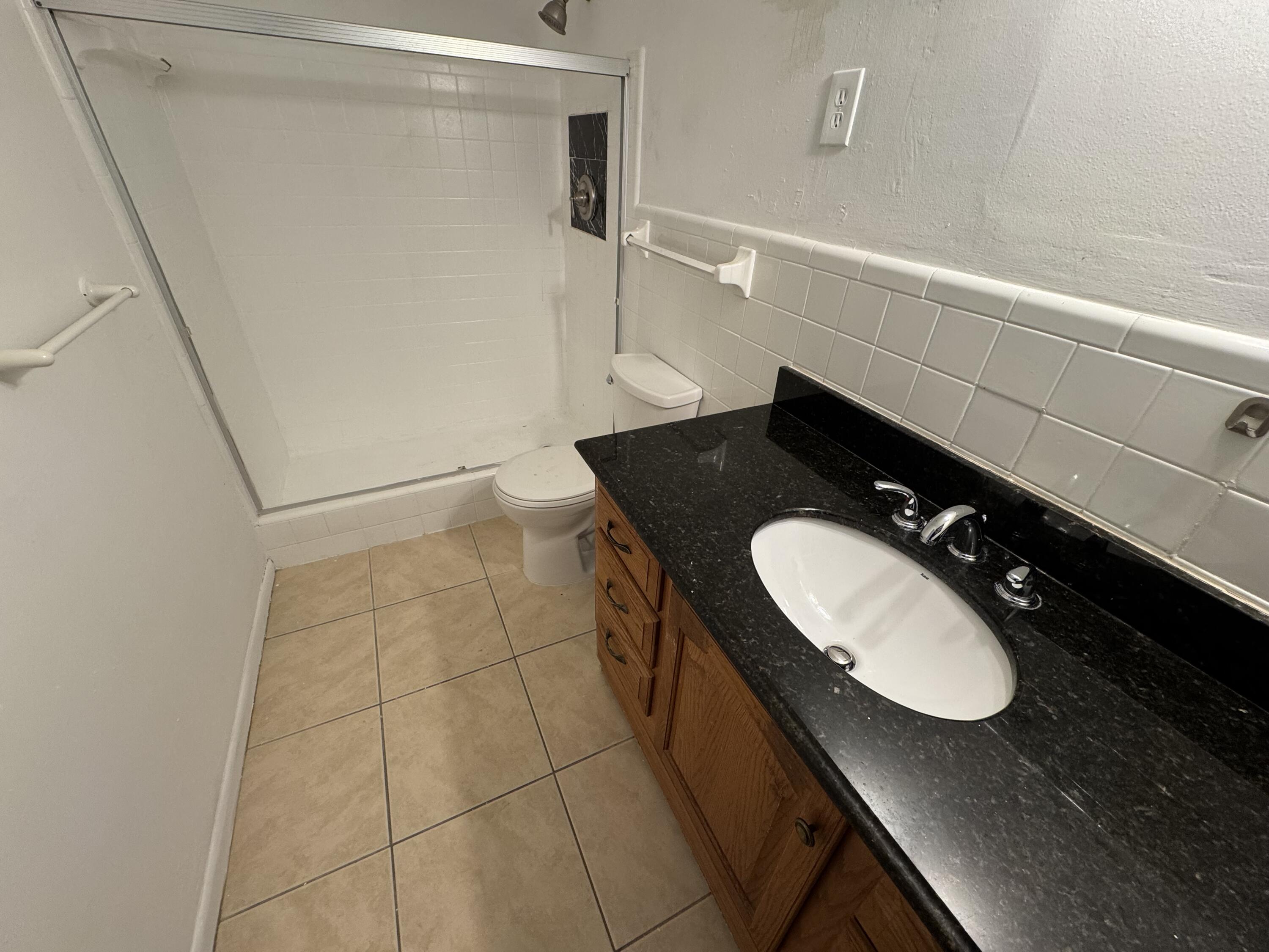 198 Southwest 15th Street Boca Raton, FL 33432 - Photo 10 of 11 a bathroom with a sink and a mirror