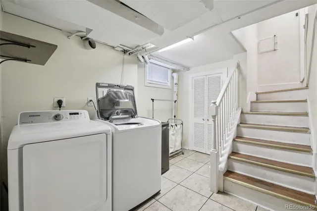 a view of storage and utility room with washer and dryer