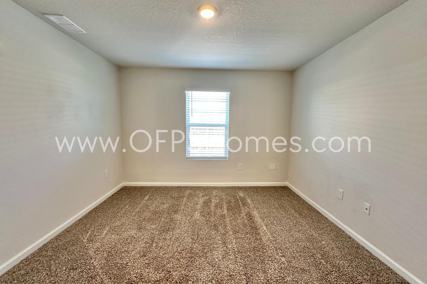 853 Otto Loop Crestview, FL 32539 - Photo 11 of 36 a view of an empty room with a window