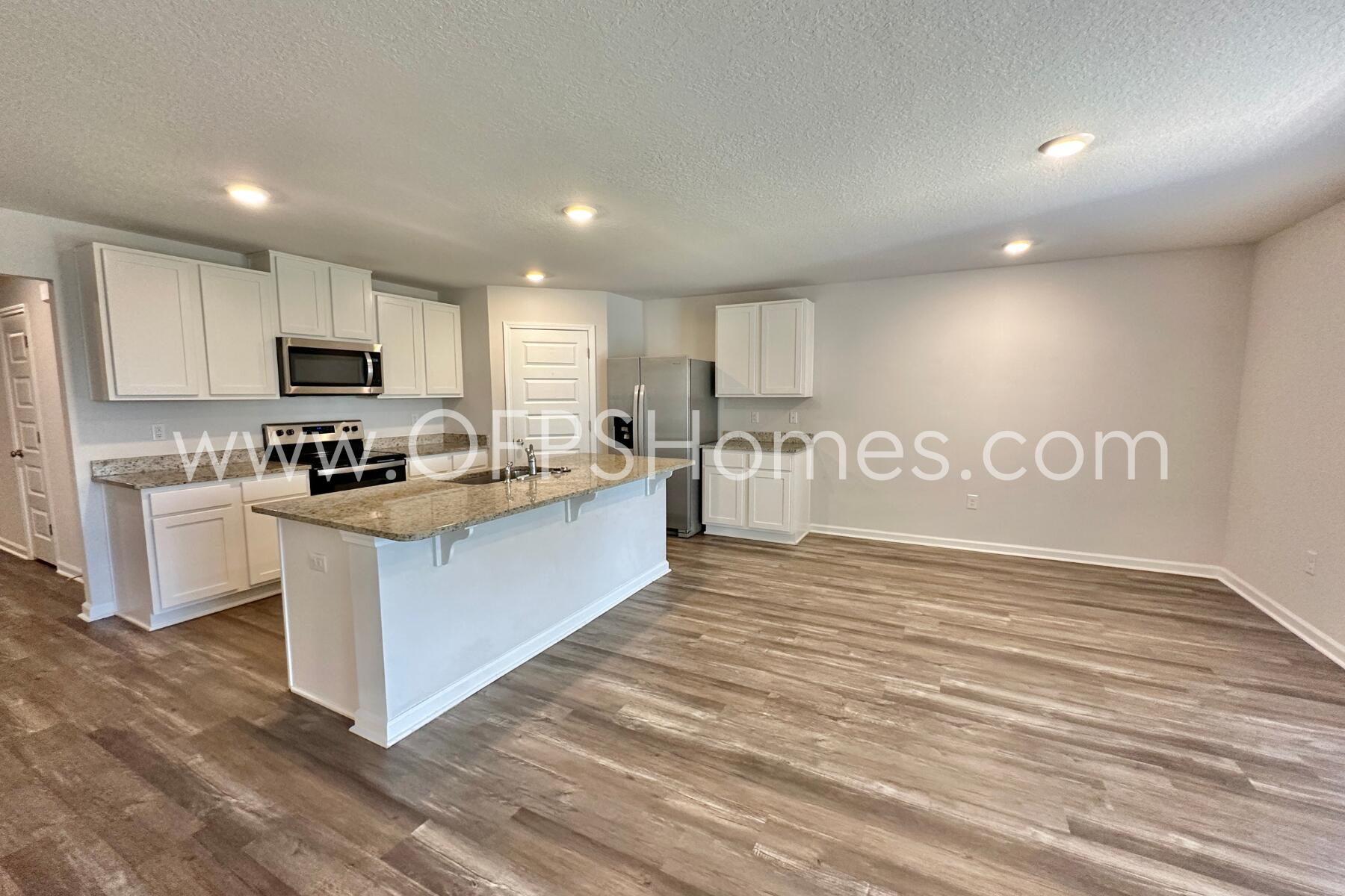 853 Otto Loop Crestview, FL 32539 - Photo 15 of 36 a large kitchen with cabinets