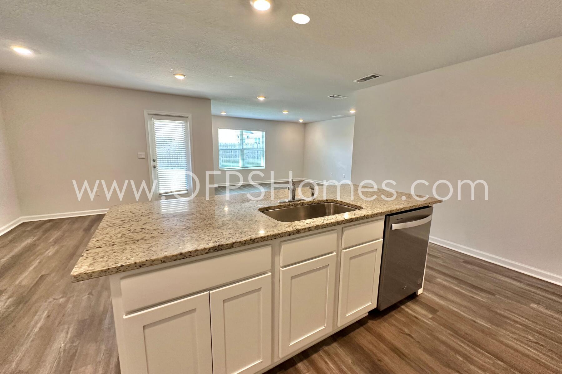 853 Otto Loop Crestview, FL 32539 - Photo 18 of 36 a kitchen with sink and mirror