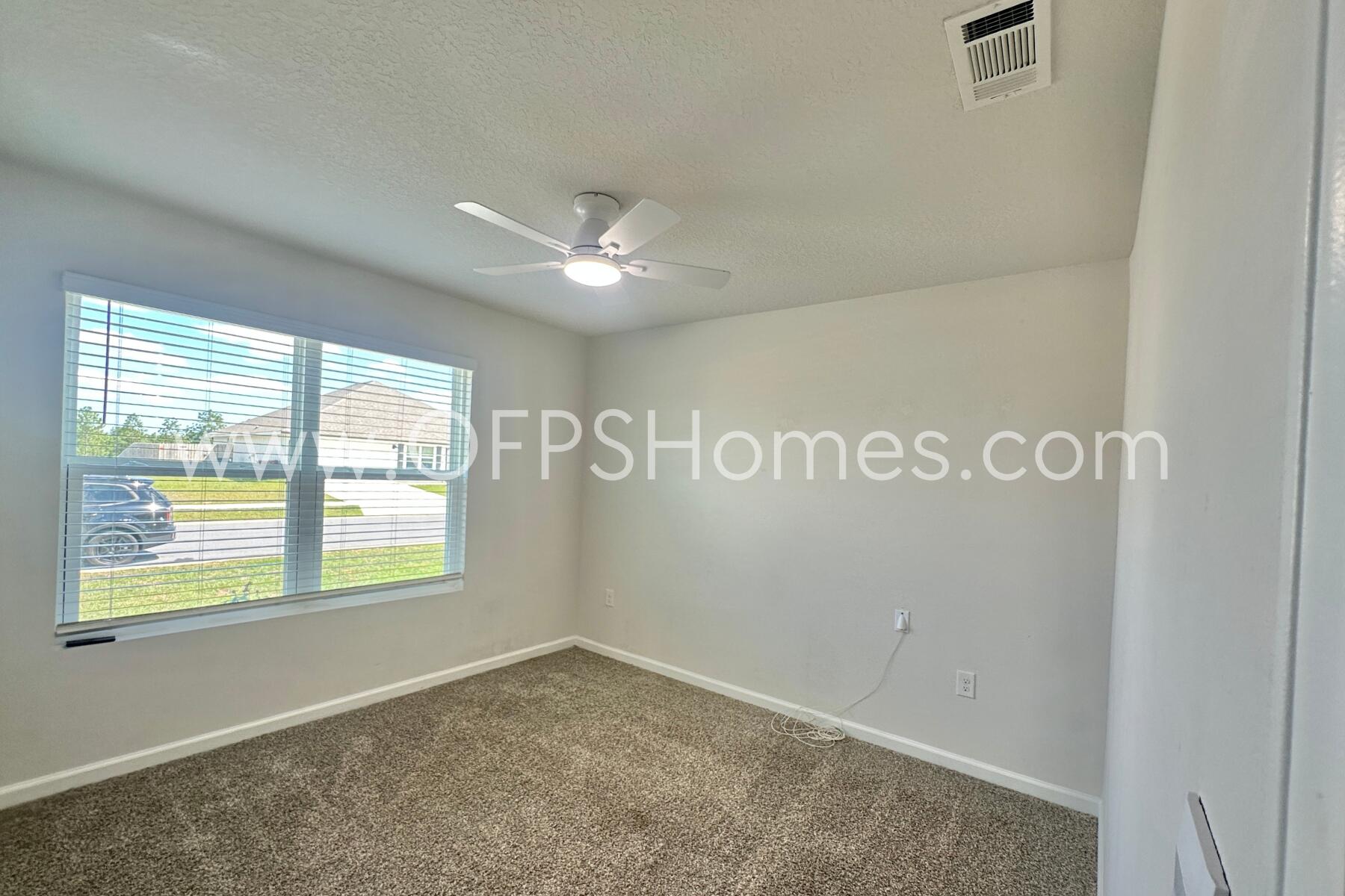 853 Otto Loop Crestview, FL 32539 - Photo 5 of 36 a view of an empty room with a window