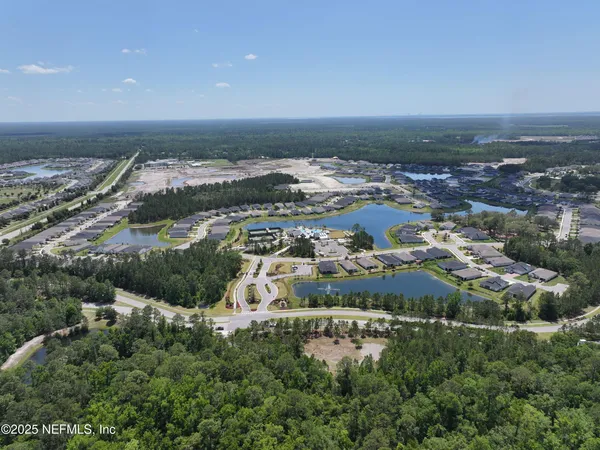 an aerial view of residential building with parking space