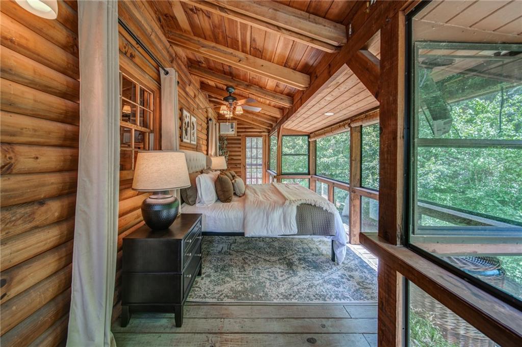 64 Bear Lake Drive Blue Ridge, GA 30513 - Photo 12 of 28 a view of living room with furniture and a floor to ceiling window